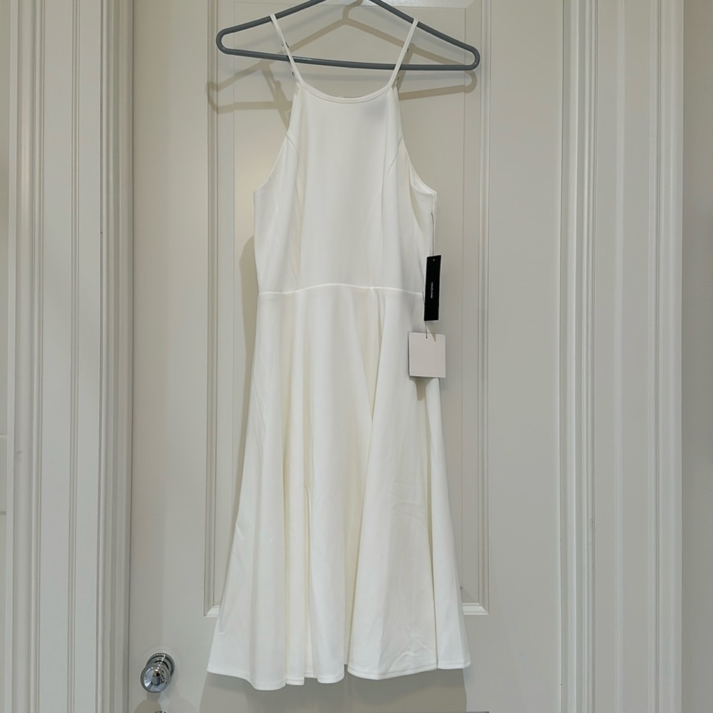 White, halter neck, mini dress from Lulu’s. Size S.